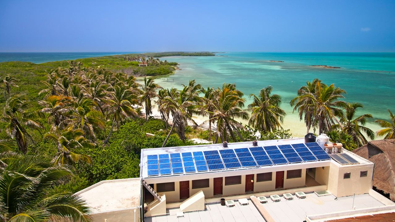 Sustainable hotel on a tropical beach with solar panels