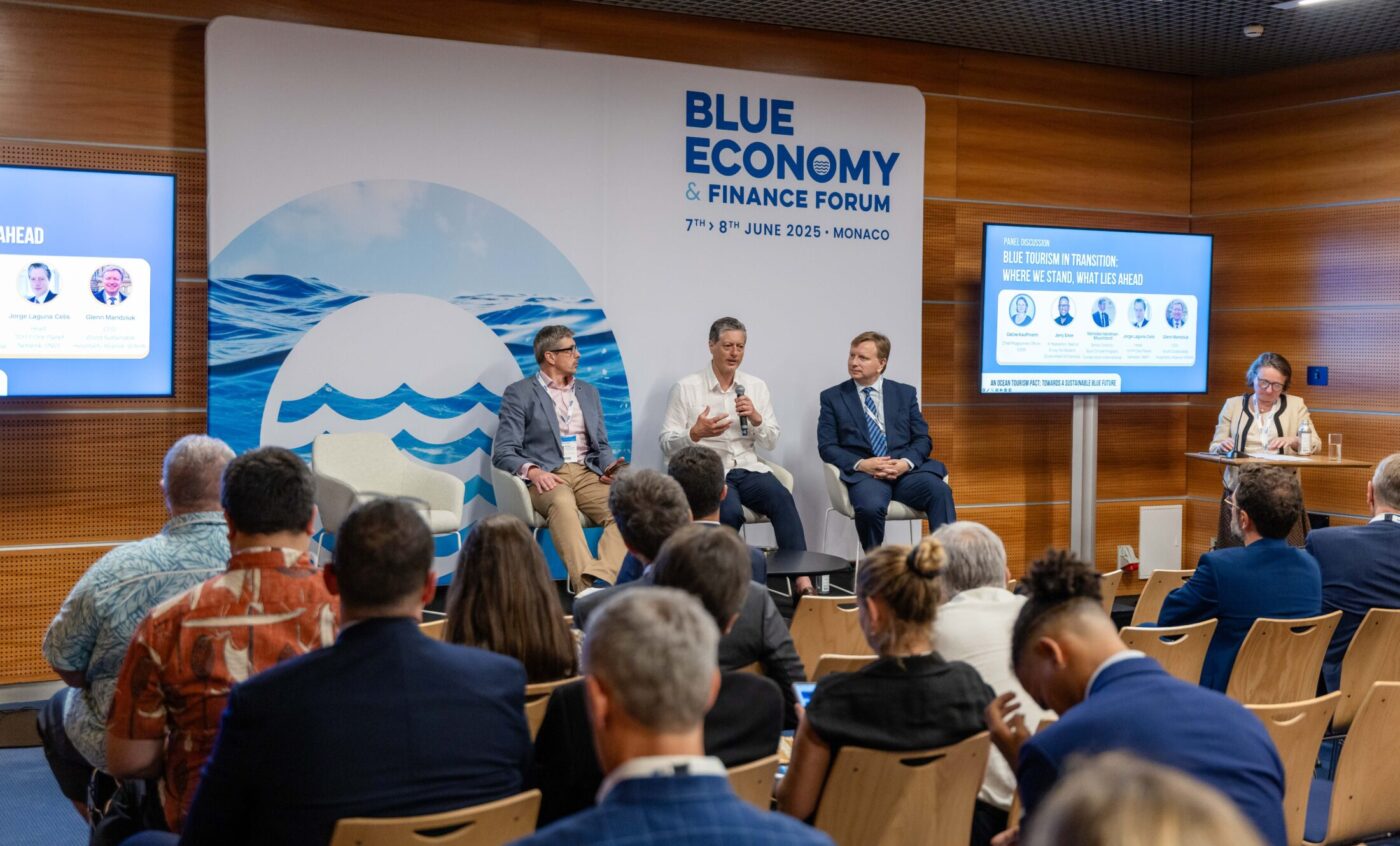 Alliance CEO, Glenn Mandziuk, and fellow leaders announce the Ocean Tourism Pact on stage at the Blue Economy and Finance Forum.